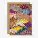 A colorful floral birthday greeting card with gold foil details, featuring a variety of plants and flowers, blank interior, and comes with a recycled brown envelope.