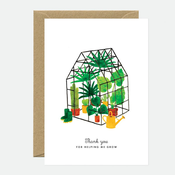 A greeting card depicting a mini greenhouse with plants and the text 'Thank you for helping me grow', accompanied by a brown envelope.