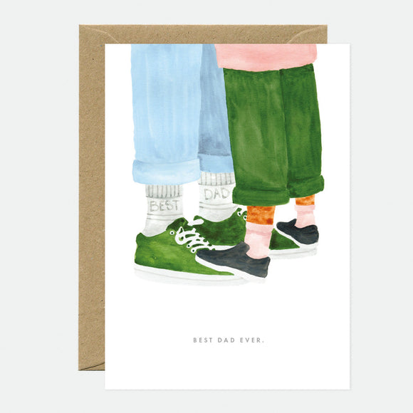A greeting card depicting an illustration of two pairs of socks, one in blue and one in green, with matching shoes placed next to them. The socks are positioned as if worn by a person standing.