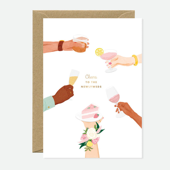A greeting card with gold foil illustrations of various drinks and hands toasting, with a blank interior and a brown envelope.