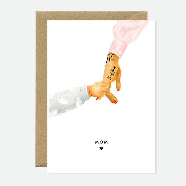 Greeting card with an illustration of a mother and baby's hands holding each other's, with the word 'Mom' and a heart symbol below their hands.