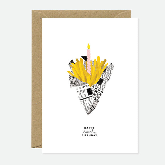 A greeting card with a cartoon illustration of a snack packet with a candle on it, and the text 'Happy crunchy birthday'. It comes with a brown envelope.