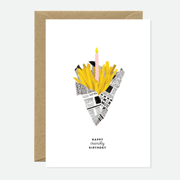 A greeting card with a cartoon illustration of a snack packet with a candle on it, and the text 'Happy crunchy birthday'. It comes with a brown envelope.