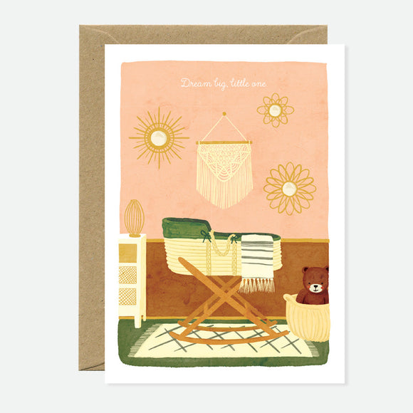 Greeting card with an illustration of a room with a chair, a bear, and a rattan chair, on a pink background, paired with a recycled brown envelope.