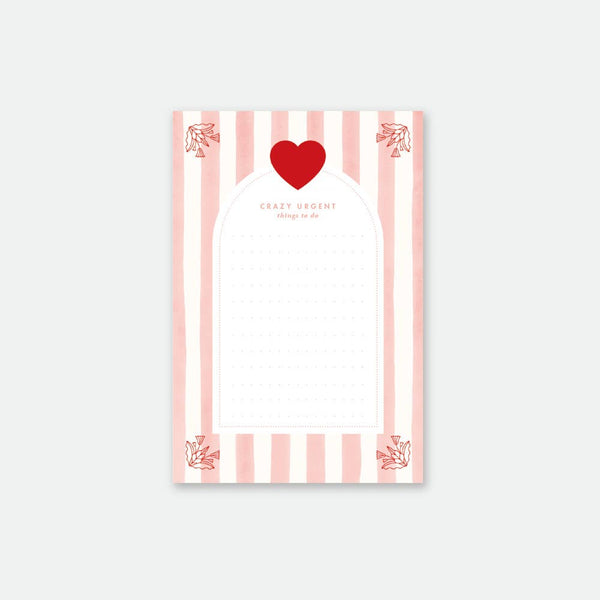 All the Ways to Say Pink Stripes Notepad A6 with pink and white stripes, red heart, and 50 pages of high-quality writing paper.