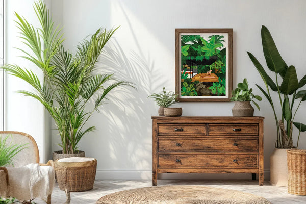 Namaster poster framed on a wall above a wooden chest surrounded by green plants