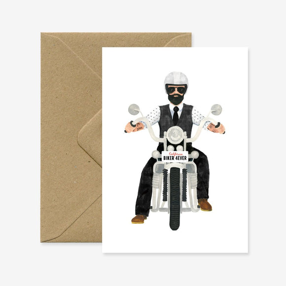 A greeting card with an illustration of a man in a suit riding a motorcycle, accompanied by a brown envelope.