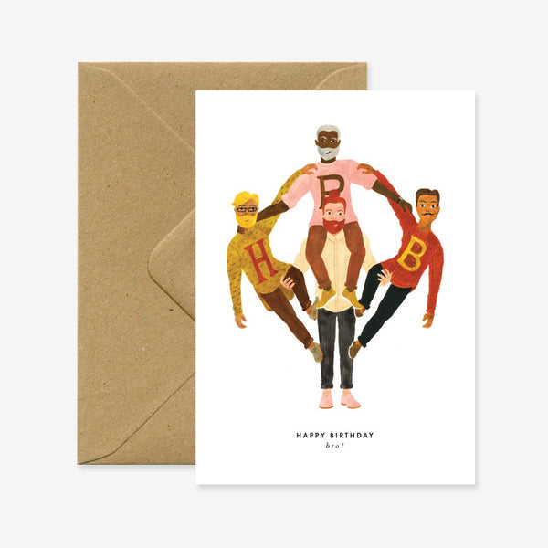 A birthday greeting card with a cartoon illustration of two people celebrating, accompanied by a brown envelope.