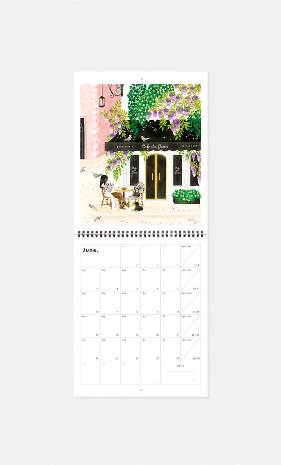 Inside page of Travel Bucket List 2026 calendar by All the Ways to Say with June monthly planner and café terrace illustration
