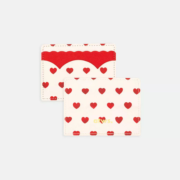 Card holder with red heart print on white background, scalloped leather detail, and atws gold logo branding.
