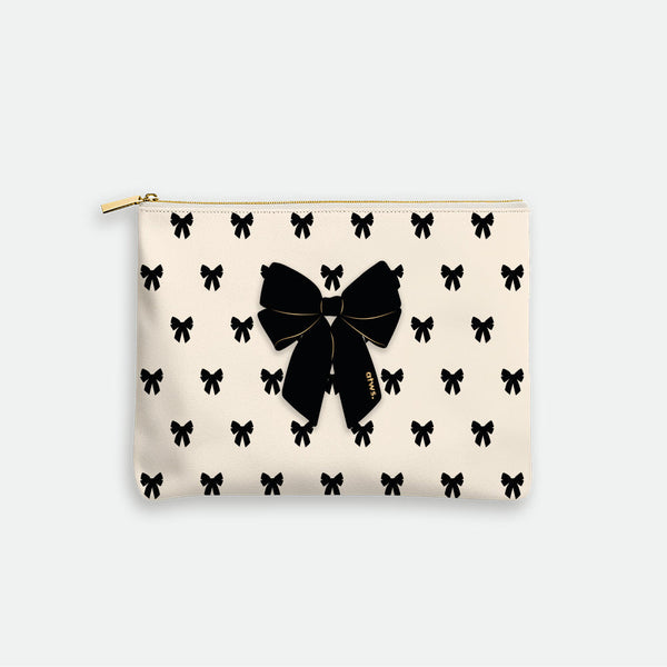 black bow cream pouch bag by All The Ways To Say