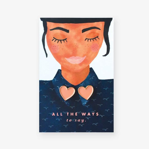 Hearts enamel pins by All the Ways to Say featuring gold-plated heart shapes in soft peach color, perfect for collars, jackets, or gifting.