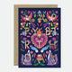 A colorful birthday greeting card with gold foil details, a recycled brown envelope, and a blank interior.