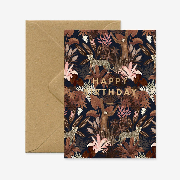 A birthday greeting card with a floral and animal pattern, featuring gold foil details, and the text 'Happy Birthday'. There is a recycled brown A6 envelope included.
