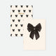 Set of two A6 pocket notebooks, one with large black bow illustration, the other with repeated bow pattern and gold “notes” detail, by All the Ways to Say.