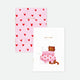 Set of two A6 pocket notebooks, one with two cats sharing a pink heart sweater, the other with pink cover and scattered red hearts, gold foil detail.