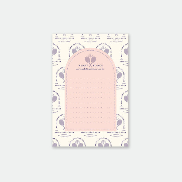 A notepad with a tennis-inspired design, featuring sports equipment and motifs in a pink color scheme.