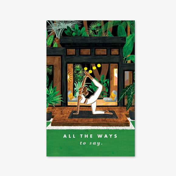 Yoga enamel pin by All the Ways to Say featuring gold-plated yoga pose design on tropical studio background with green and brown tones.