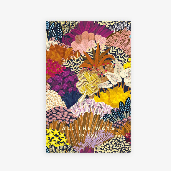 Lucky Clover enamel pin by All the Ways to Say featuring gold-plated four-leaf clover on colorful botanical illustrated background.