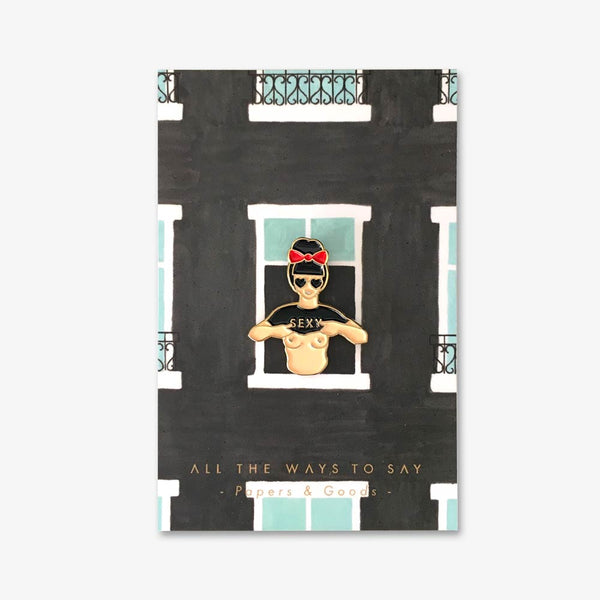 Hey Sexy enamel pin by All the Ways to Say featuring gold-plated retro woman design with red bow and “SEXY” shirt on illustrated window background.