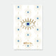 A radiant blue lucky eye enamel pin by All The Ways To Say with gold rays, displayed on a matching patterned backing card.