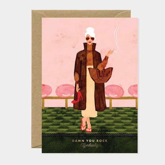 A chic greeting card by All The Ways To Say featuring a watercolor woman with white hair and sunglasses holding red heels with the text "DAMN YOU ROCK Effortlessly."