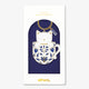 A cute gold enamel keychain by All The Ways To Say featuring a white cat in a blue patterned mug, presented in its navy blue gift box.