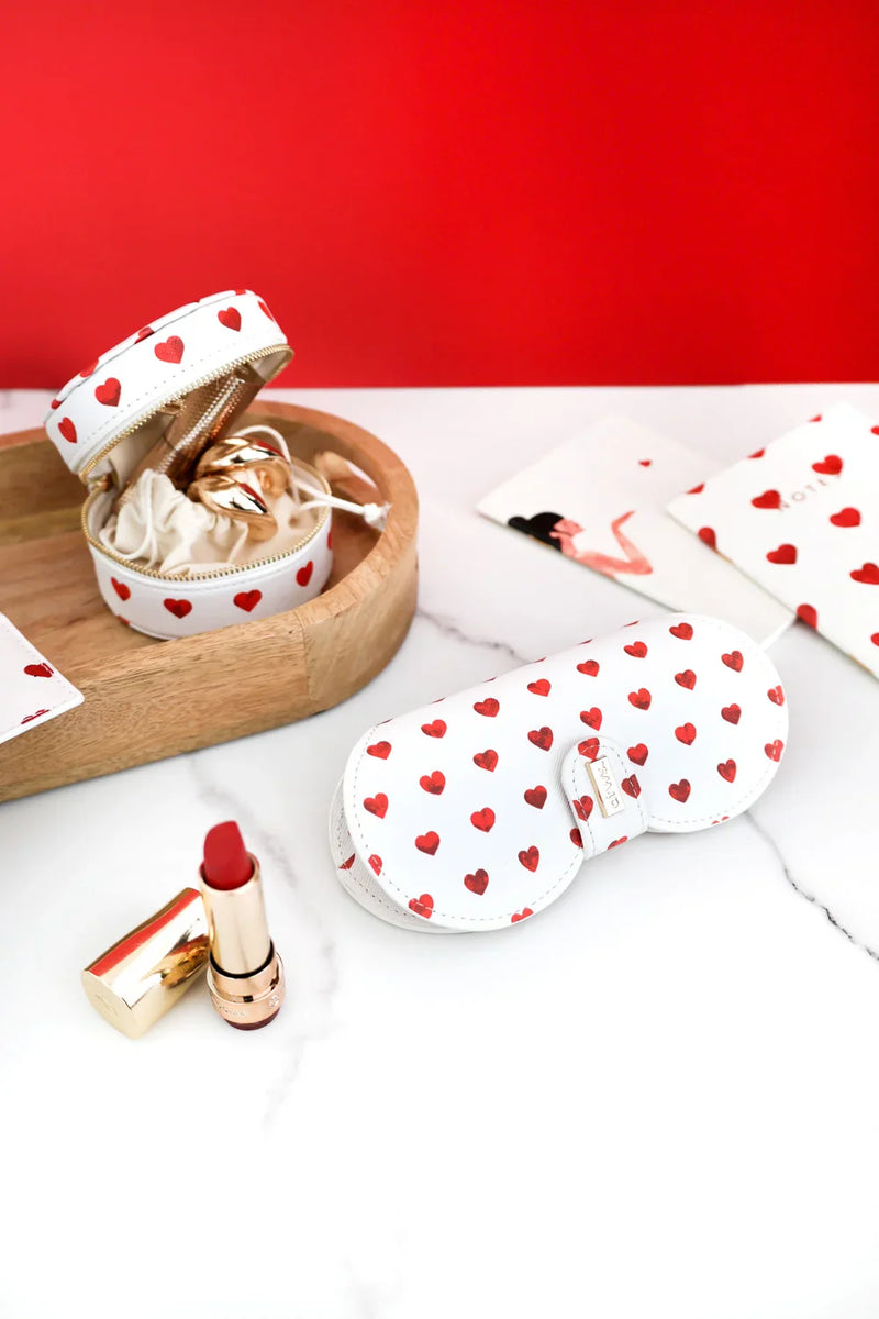 Red Hearts jewelry case and glasses case with red hearts pattern, styled with red lipstick and wooden tray.