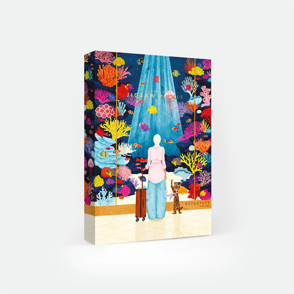 Boarding Soon 1000-piece jigsaw puzzle box by All The Ways To Say, illustration of a woman and her cat waiting at an airport gate surrounded by a colorful coral reef, text reads "Jigsaw Puzzle".