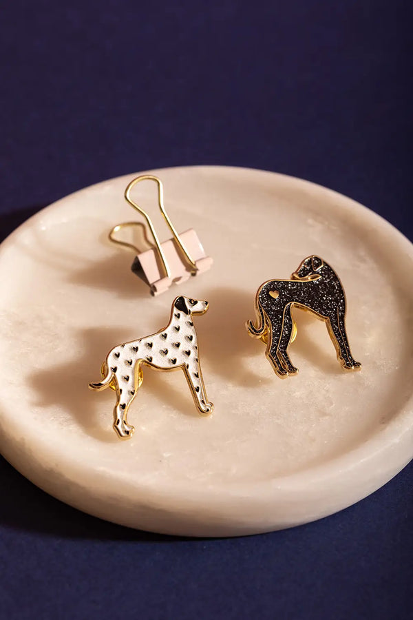Dalmatian - Pins: A duo of white heart-patterned and glittery black dalmatian enamel pins.
