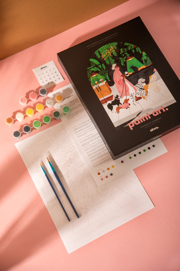 Dog Sitter paint by numbers kit with black box, numbered canvas, 15 paint pots, two brushes, color chart and instructions