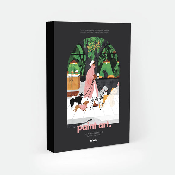 Dogsitter paint by numbers kit box by All The Ways To Say, illustration of a woman walking five dogs past a New York storefront window filled with cakes and a black cat, neon "New York" script above a wall of green plants, "paint art. The Paint By Number Kit by All The Ways To Say"