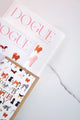 Dogue notebooks with dog illustrations and matching card on marble surface