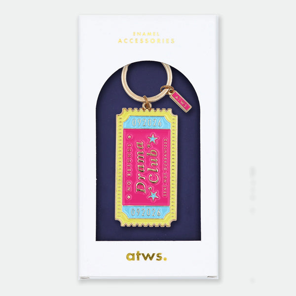 Enamel and metal keychain shaped like a vintage show ticket, pink and yellow with text reading "092026, Drama Club, No refunds, Seat not guaranteed," gold-tone ring and "ATWS" charm