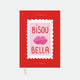 A5 Hardcover notebook with a vibrant red cover featuring a pink stamp illustration with lips and the text Bisou Bella by All the Ways to Say.
