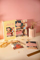 Jomo A5 hardcover notebook with matching California Diner notebooks and a "Chic b*tch" mini notebook on a desk