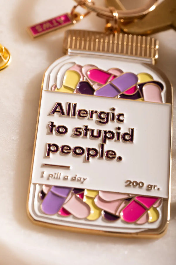 Allergic to stupid people Keychain - Focus on the engraved text and vibrant pill jar design.