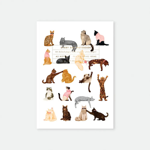 Meow. A5 notebook cover by All The Ways To Say, illustration pattern of eighteen cats of different breeds and colours in various poses, some wearing small sweaters, on a white background