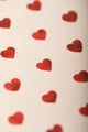 Notebook A5 New Hearts - Macro shot of the red heart illustrations and premium natural paper texture.