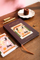 How to be fulfilled Hardcover Notebook A5 - Angled view showing the burgundy cover and gold foil title.