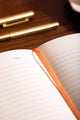 How to be fulfilled Hardcover Notebook A5 - Interior view of lined pages with an orange satin bookmark.