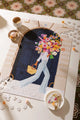Parisian Door - Puzzle 1000 pieces: wide view of the puzzle styled with lifestyle accessories and a golden key.
