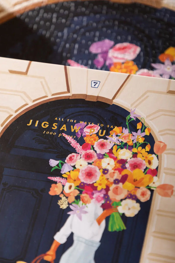 Parisian Door - Puzzle 1000 pieces: close-up of the premium gold foil "Jigsaw Puzzle" text on the box lid.