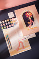 Parisian Door paint by numbers kit with pink box, canvas, numbered paint pots, two brushes, stickers and color chart