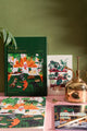 LIFE WITH PETS & PLANTS - Collection: high-angle shot of the "Art of Not Going Out" green journal and cat-themed stationery.