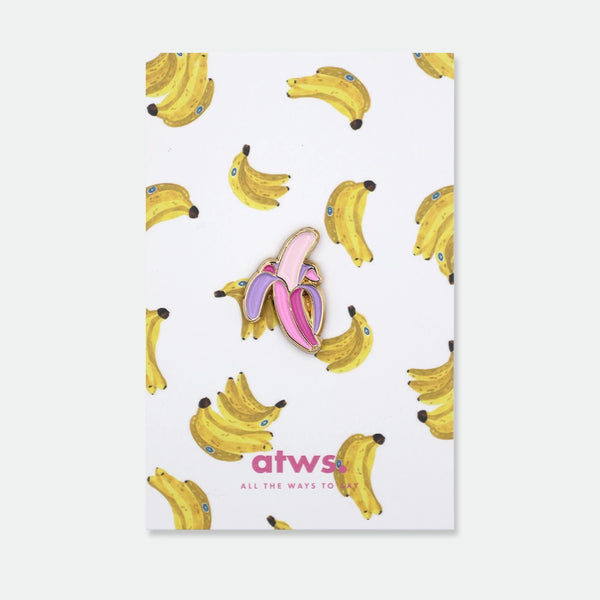 Enamel pin of a peeled banana in bold pink and purple