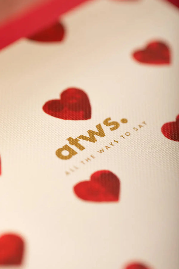 Bisou Pocket Notebook A6 DUO - Macro shot of the atws. logo in gold foil on premium paper.