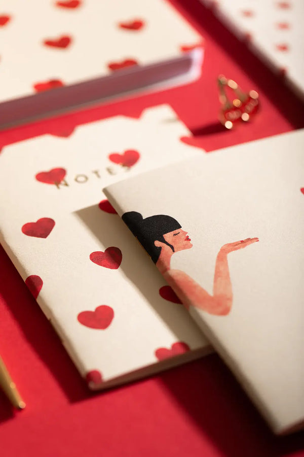 Bisou Pocket Notebook A6 DUO - Both notebooks displayed together on a red background.