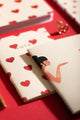 Bisou Pocket Notebook A6 DUO - Both notebooks displayed together on a red background.