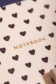 Dalmatian Pocket Notebook A6 DUO - Macro shot of the gold embossed notebook title on natural paper.